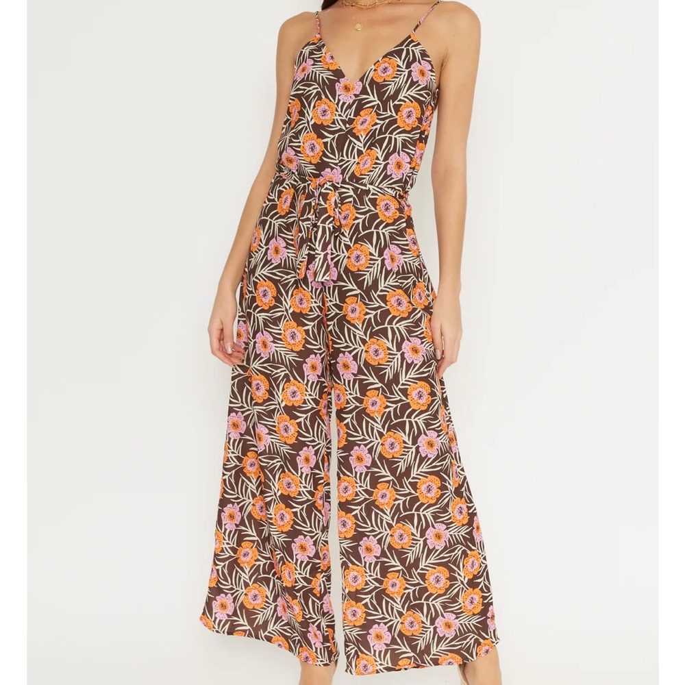 V-neck sleeveless jumpsuit with floral print throughout